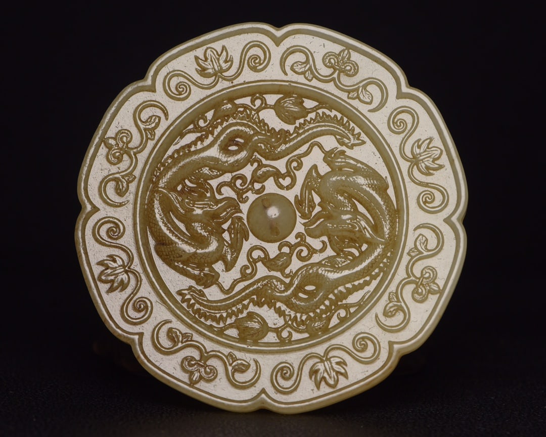 A Qing He Tian Jade Mirror: A Qing He Tian Jade Mirror, D 8.9cm, W 122g.
