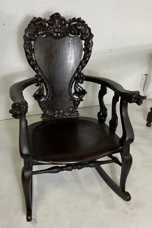 Early 20th Century Chinese Export Rocking Chair: Heavily carved early 20th century Chinese export rocking chair