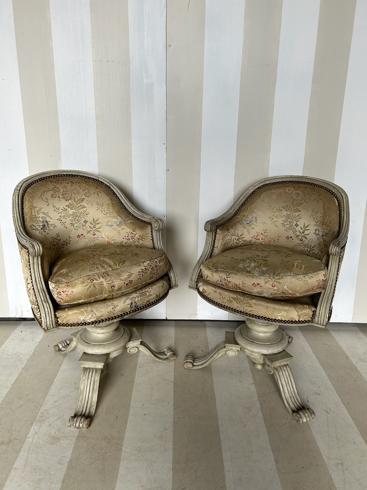 Pair of Painted French Swivel Bergeres: Pair of Painted French Swivel Bergeres