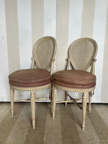 Pair of late 19th- early 20th century French painted cane salon chairs