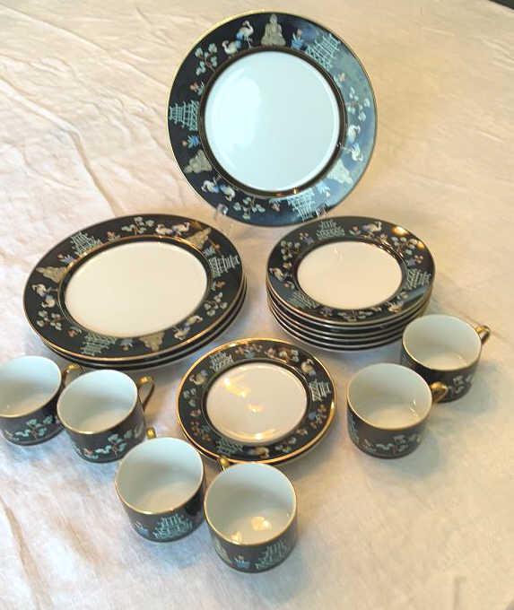 Eighteen Pieces Fitz & Floyd Chinoiserie China: 4 10 in plates, 6 7.5 in plates, 2 6.5 in plates, 6 cups. No knife blemishes.