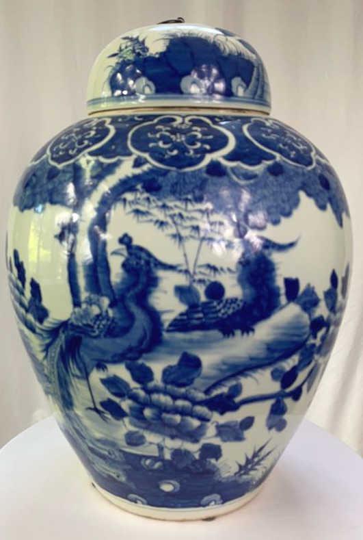 One of Two Chinese Blue & White Ginger Jars: Phoenix birds and flowers motif with medallion collar. Approximately 13 diameter by 18 tall.