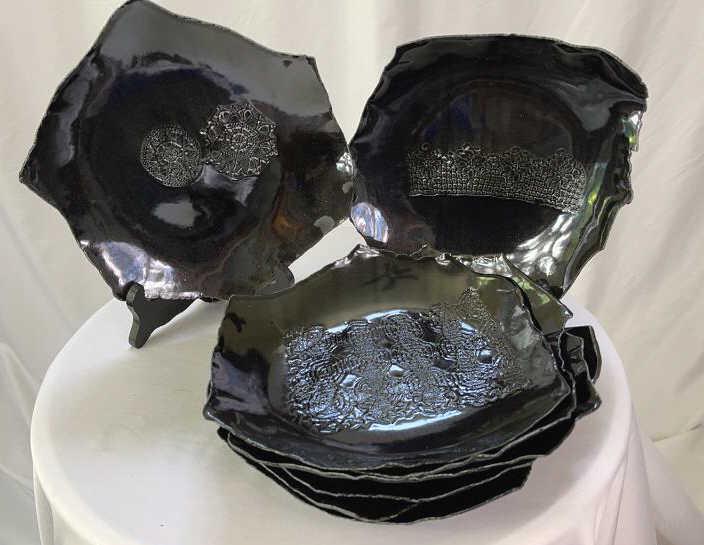 Eight Unusual Ultralight Pottery Glazed Plates: Each plate a unique and different shape. Each plate has a different pattern embossed. All signed Craven. Approximate diameter 8 to 10 inches.