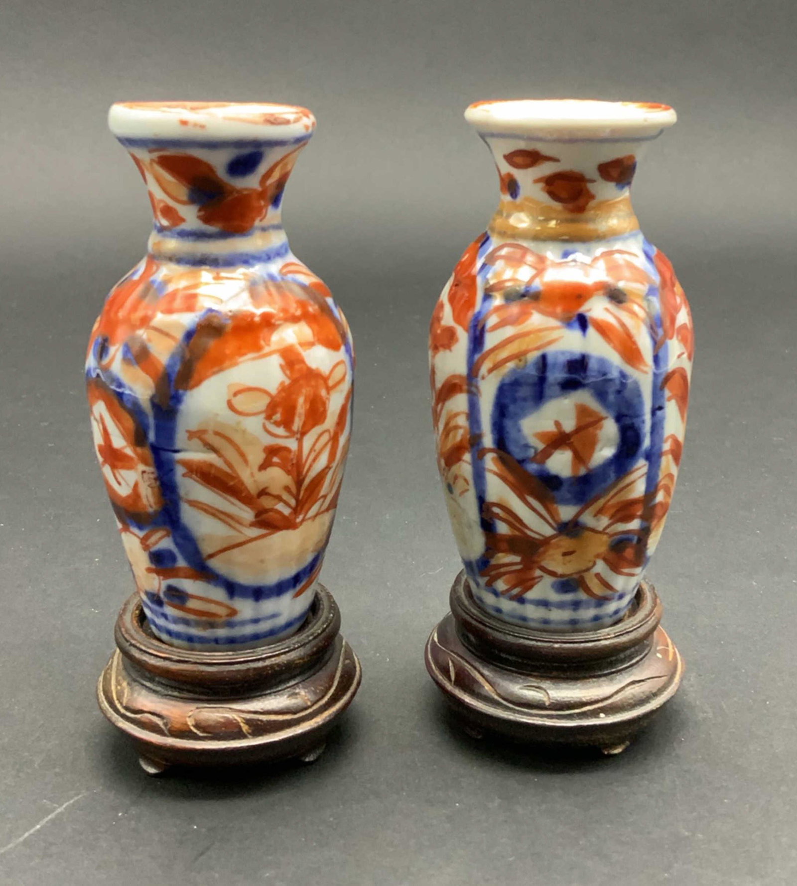 Pair of Imari Vases: Bright orange and yellows, cobalt blue trim. 1 X 3.75 with pedestals.