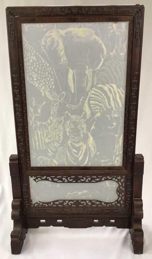 Asian Fireplace Screen: Lucite animal pattern on glass in a carved wood frame, 24x43 tall. Small section of fretwork has broken off.