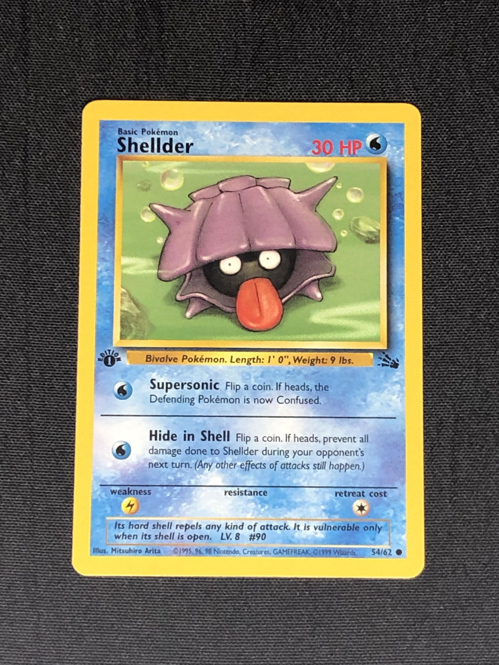 1st Edition Fossil Set Shellder Pokemon Card - Moderately Played Condition: 1st Edition Fossil Set Shellder Pokemon Card - Moderately Played Condition