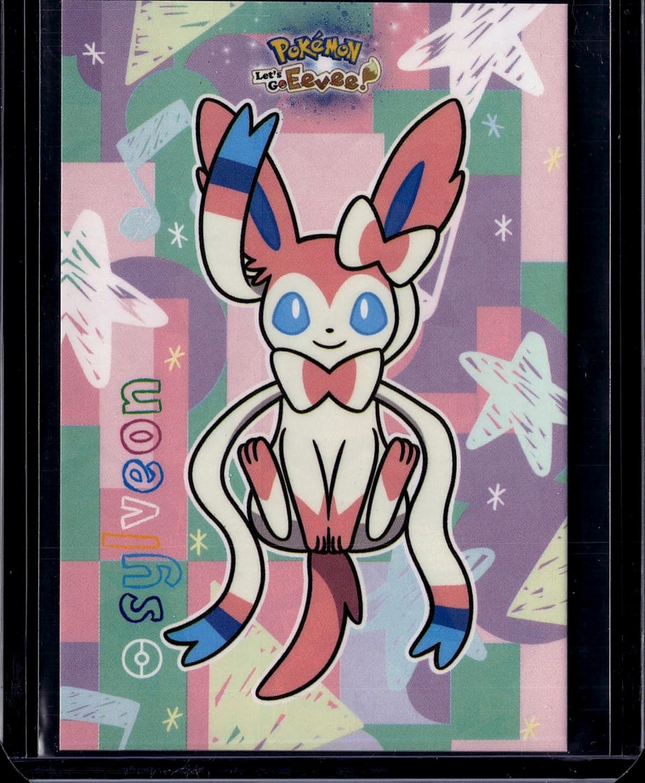 Pokemon Let's Collect Sylveon Card - Mint Conditi: This is a stunning Sylveon card from the Pokemon Let's Collect series, featuring the beloved Fairy-type Pokemon in its iconic pose. The card showcases vibrant pink, blue, and white coloring with Sylve