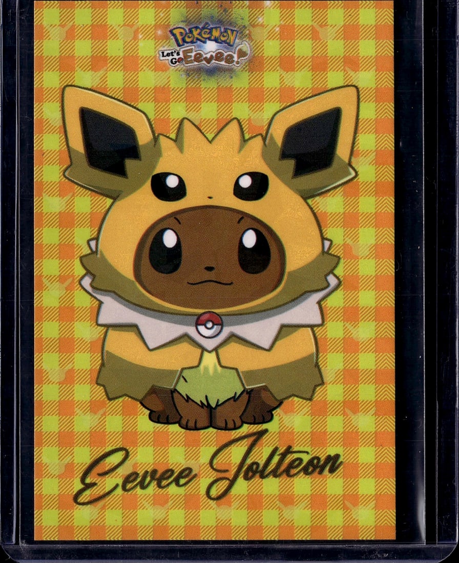 Pokemon Let's Go Eevee Eevee Joltem Promotional C: This is an official Pokemon promotional card from the Let's Go Eevee game merchandise line. The card features Eevee wearing the iconic yellow and brown outfit associated with the Let's Go Eevee
