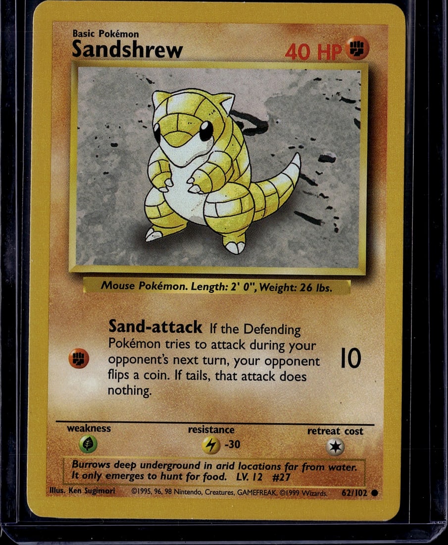 Sandshrew 62/102 Base Set 1999 Pokemon Card - Cla: This is an authentic Sandshrew Pokemon trading card from the original 1999 Base Set, card number 62/102. Sandshrew is a Mouse Pokemon featuring the Sand-attack ability that prevents opposing Pokemon f