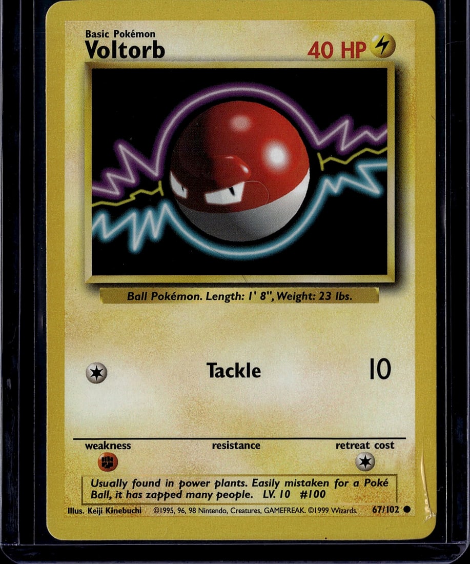 1999 Pokemon Base Set Voltorb 67/102 Very Good Co: This is an authentic 1999 Pokemon Trading Card Game Base Set Voltorb card (67/102), featuring the iconic Electric-type Ball Pokemon. The card displays vibrant red and white coloring with characteristi