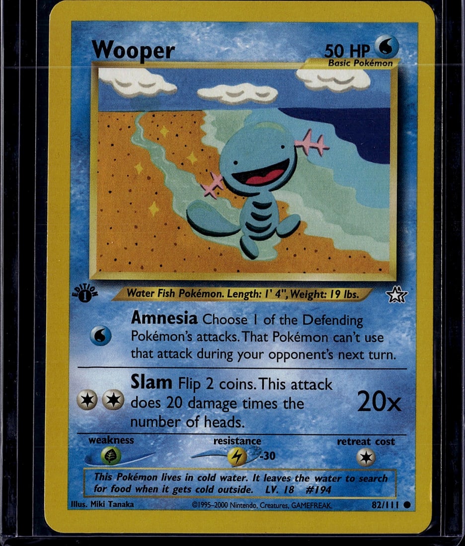 Wooper 82/111 Pokemon Base Set Card 2000 - Water: This is an original Wooper Pokemon Trading Card from the Base Set, card number 82/111, released in 2000 by Nintendo and Creatures/GAMEFREAK. The card features the iconic blue water-fish Pokemon with e