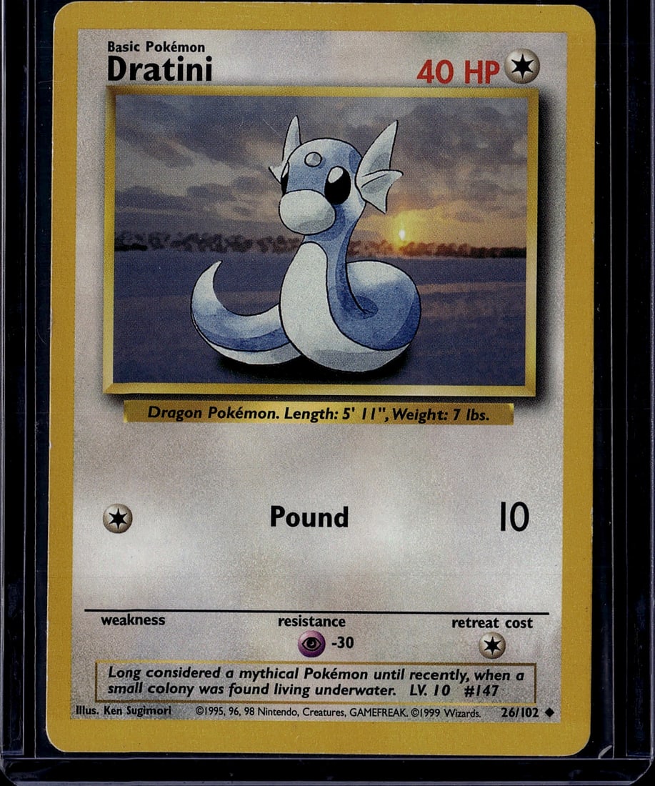 1999 Pokemon Base Set Dratini #26/102 Dragon Card: This is an authentic 1999 Pokemon Base Set Dratini card (#26/102), a classic Dragon-type Pokemon from the original trading card game release. Dratini is depicted as a mythical dragon Pokemon with its 
