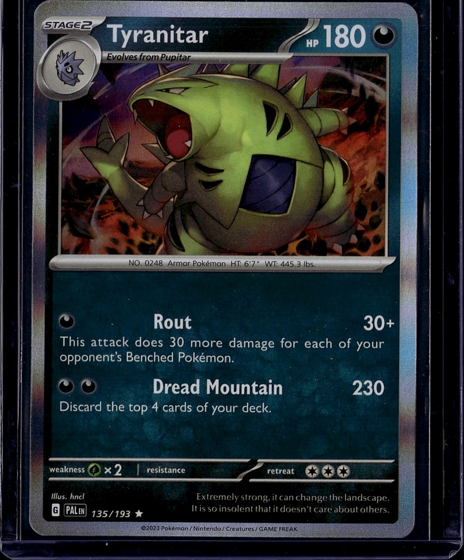 2023 Pokemon Paldea Evolved Tyranitar 135 Near Mi: This is a Tyranitar Stage 2 Pokemon card from the Scarlet & Violet expansion set, card number 135/193. The card features 180 HP and showcases beautiful holofoil artwork of the powerful Armor Pokemon. 