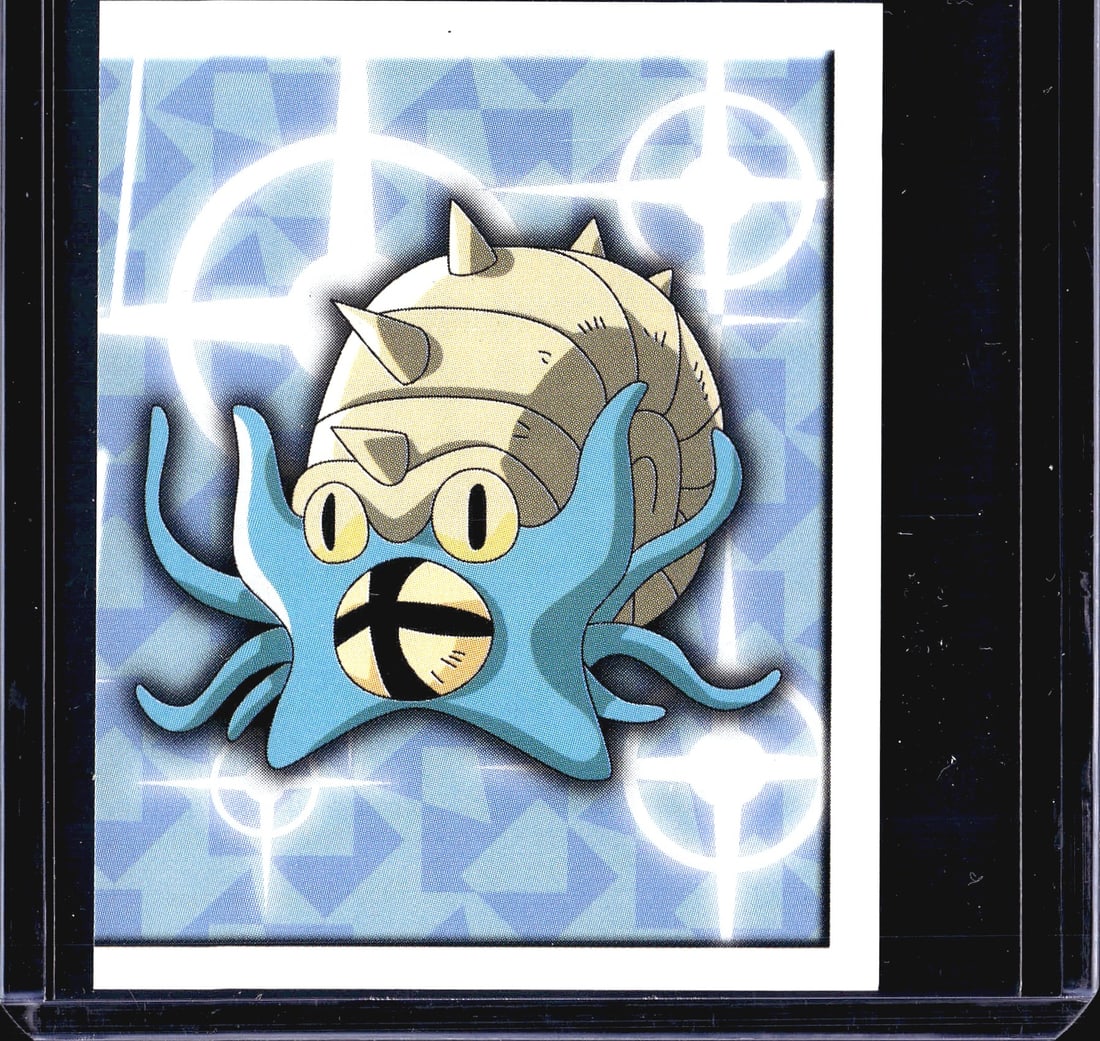 1999 Topps Merlin Pokemon Sticker Series 1 #226 O: This is sticker #226 from the 1999 Merlin Collections officially licensed Pokemon sticker series, featuring Omanyte, the Rock/Water-type fossil Pokemon. The front displays a holographic foil finish