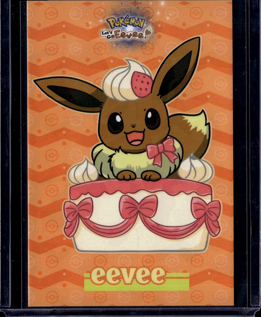 Pokemon Let's Go Eevee Official Card - Mint Condi: This is an official Pokemon Let's Go Eevee collectible card featuring the beloved Eevee character adorned with a festive birthday cake. The card showcases vibrant orange-toned artwork with Eevee sitti