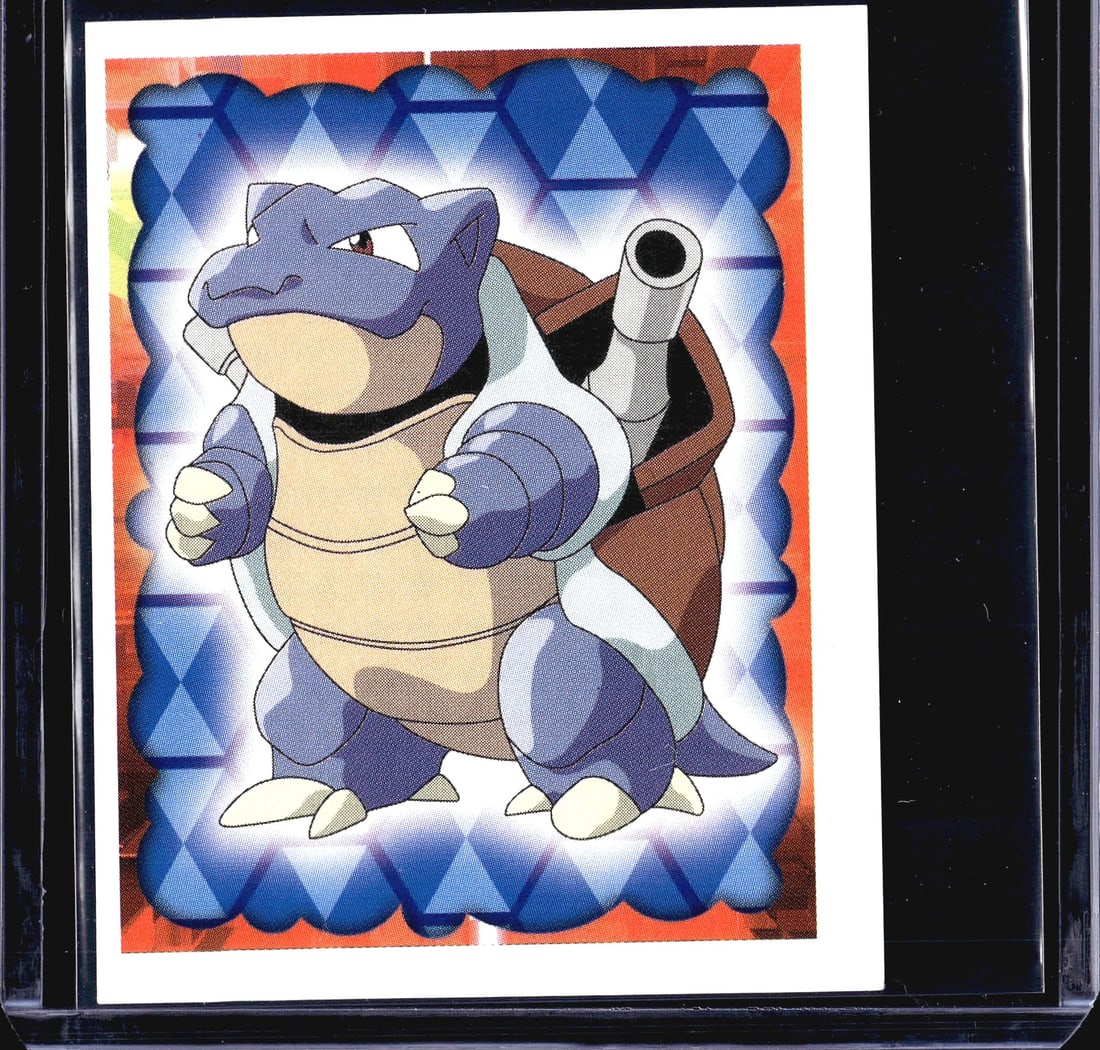 1999 Merlin Pokemon Blastoise Holo Sticker #9 Mer: This is a 1999 Merlin Collections Pokemon sticker featuring Blastoise, numbered #9. The front displays a holographic diamond-pattern border in blue with Blastoise in a dynamic pose showcasing his
