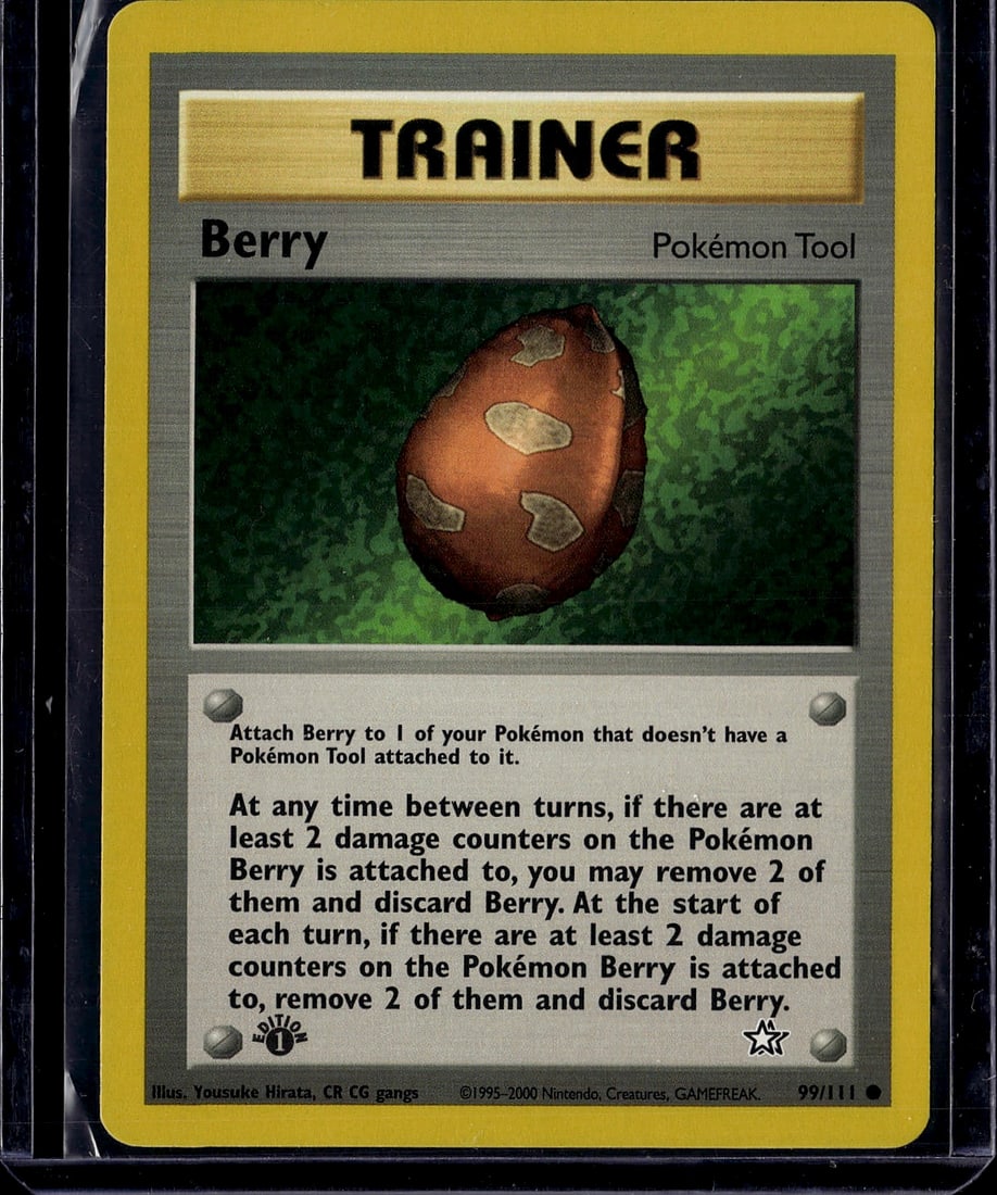 Berry Pokemon Tool Gym Heroes 99/111 Vintage 2000: This is an authentic Berry Pokemon Tool trainer card from the Gym Heroes set, released in 2000. Card #99/111 features the iconic brown berry with seed markings illustrated by Yousuke Hirata. The card 