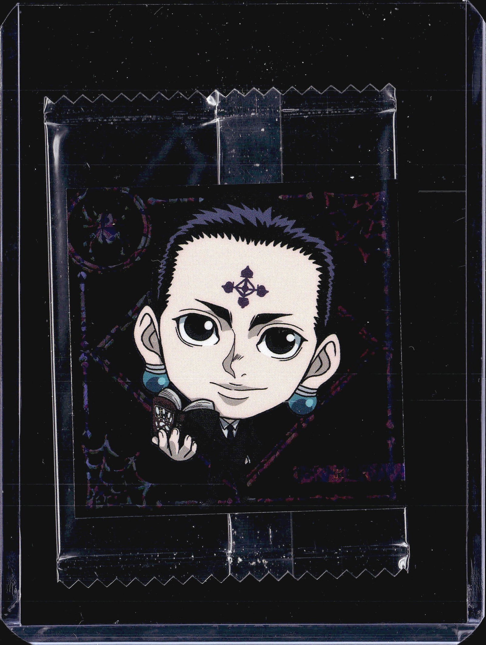 Hunter x Hunter Wafer Sticker HH3-07 Chrollo Luci: This listing features a 2024 Bandai Hunter x Hunter sealed promo sticker pack featuring Chrollo Lucilfer, the leader of the Phantom Troupe. The front of the pack displays a colorful chibi-style illust