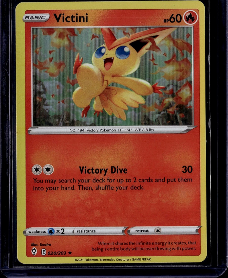 2021 Pokemon Sword & Shield Victini Basic 020/203: This is a raw 2021 Pokemon Sword & Shield Basic Victini card numbered 020/203, featuring the legendary Victory Pokemon in pristine condition. Victini is a Fire-type Basic Pokemon with 60 HP, illustrat
