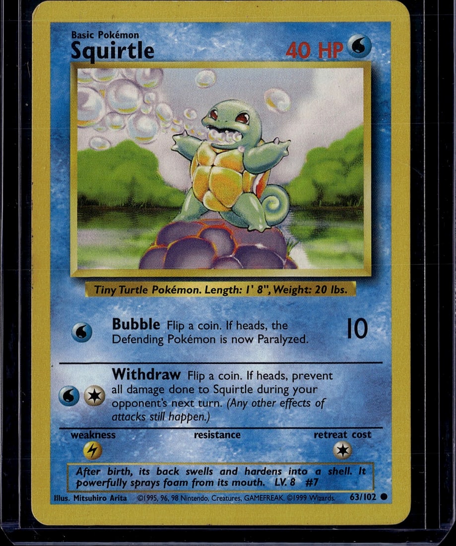 1999 Pokemon Base Set Squirtle Card #63/102 - Tin: This is an original 1999 Pokemon Trading Card Game Base Set Squirtle card, card number 63/102. Squirtle is a Basic Water-type Pokemon featured with iconic artwork by Mitsuhiro Arita. The card displays
