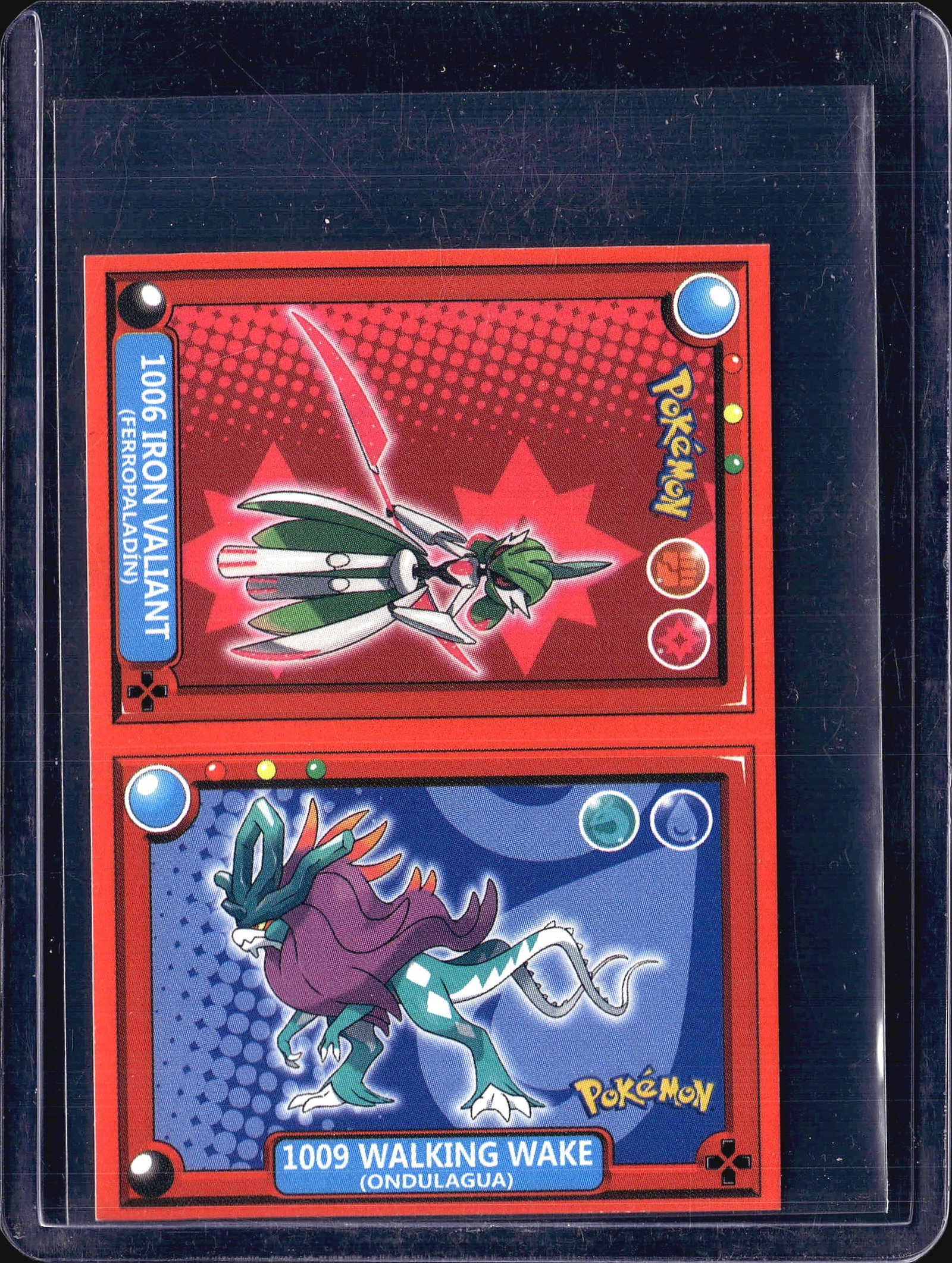 2-Card Lot Modern Pokemon Holo Trading Cards TCG: This lot contains two modern Pokemon trading cards displayed in protective sleeves. The cards feature holographic foil finishes with vibrant red and blue backgrounds characteristic of contemporary Pok