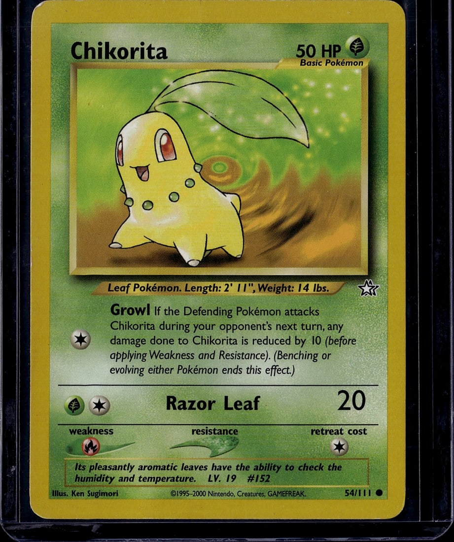 Chikorita Base Set 54/111 Pokemon Card 1999 - Ver: This is an authentic Chikorita Pokemon Trading Card from the classic Base Set, released in 1999. Card number 54/111, this Grass-type Basic Pokemon features the iconic artwork by Ken Sugimori.