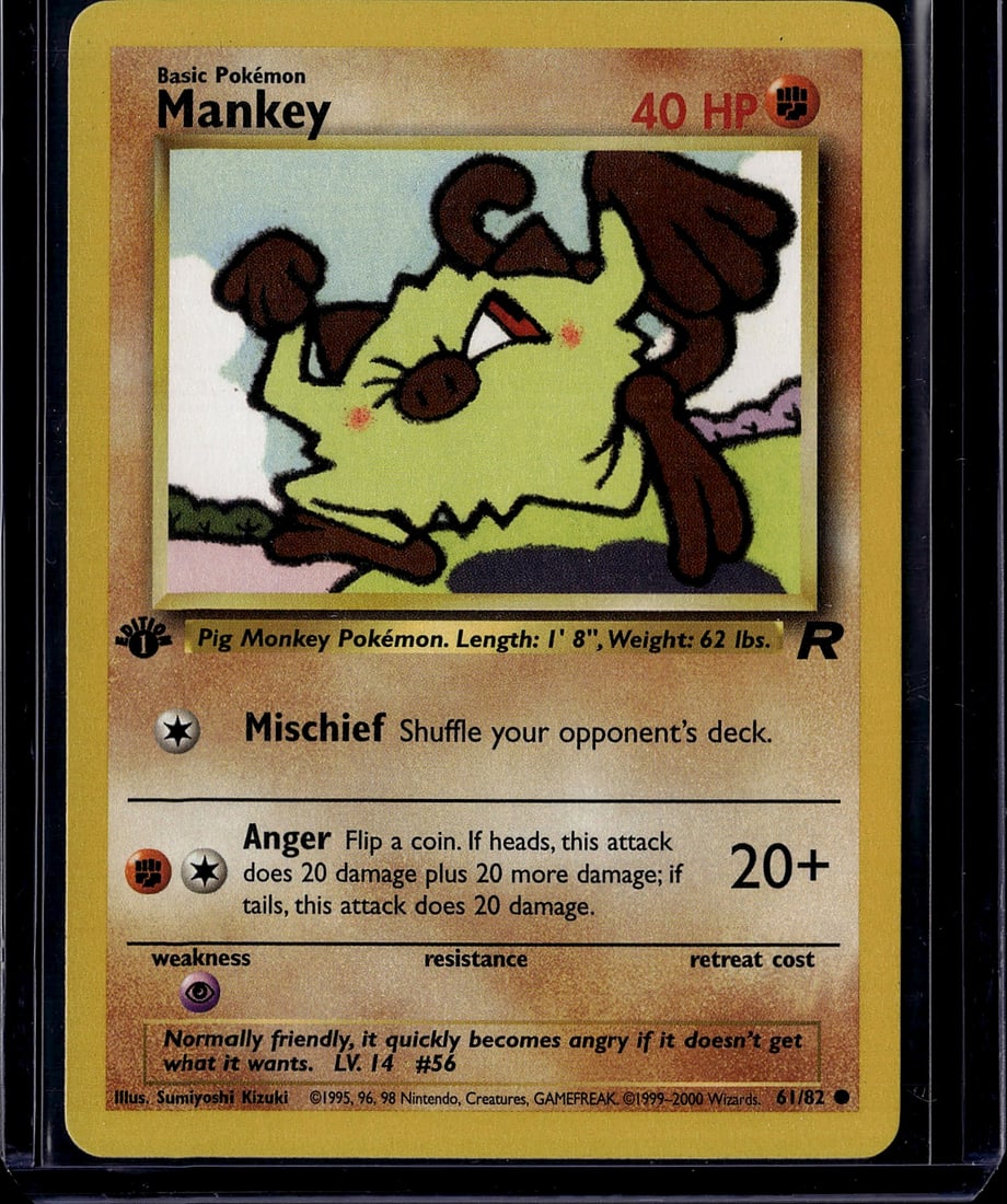 1999 Pokemon Base Set Mankey #61/82 Near Mint Con: This is an original 1999 Pokemon Trading Card Game Base Set Mankey card, numbered 61/82. Mankey is a Basic Pokemon with 40 HP featuring a Fighting-type designation. The card displays the classic artwo