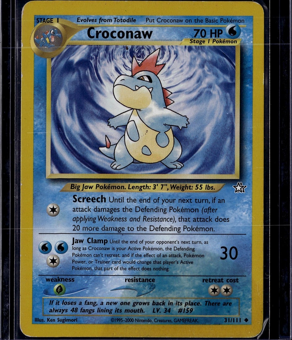 Croconaw 31/111 Neo Genesis Pokemon Card - Stage: This is an authentic Croconaw Pokemon Trading Card from the Neo Genesis set, card number 31/111. As a Stage 1 Water-type Pokemon that evolves from Totodile, this card features the classic Ken Sugimori