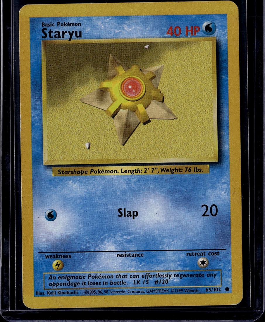 1999 Pokemon Base Set Staryu #65/102 Card: This is a 1999 Pokemon Base Set Staryu card, card number 65/102, featuring the iconic Water-type starshape Pokemon. The card displays the classic early Pokemon TCG design with Staryu's distinctive app