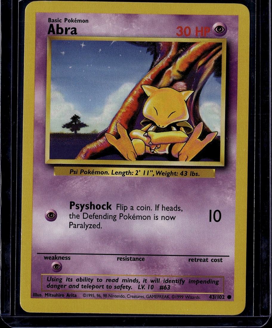 1999 Pokemon Base Set Abra #43/102 Card: This is an authentic 1999 Pokemon Base Set Abra card, card number 43/102. Abra is a Basic Psychic-type Pokemon with 30 HP, illustrated by Mitsuhiro Arita. The card features the classic Psi Pokemon wit