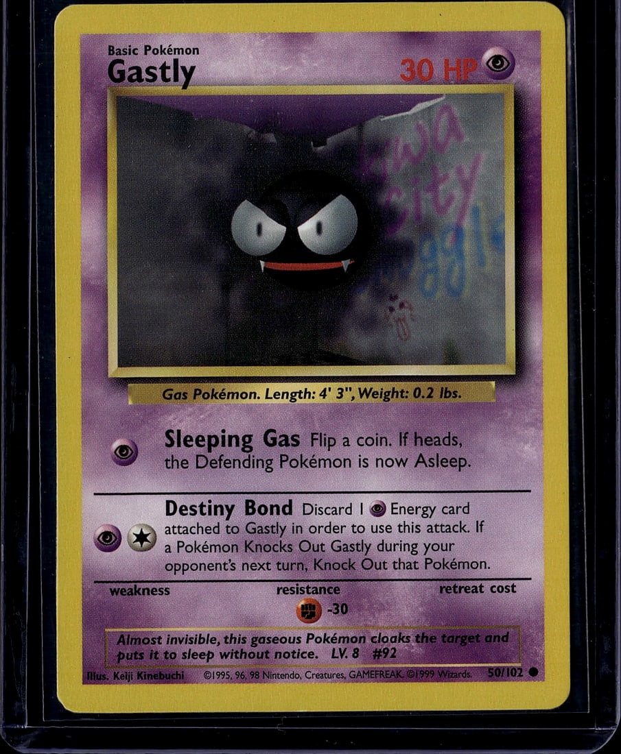 Gastly Base Set 50/102 Pokemon Card 1999: This is a 1999 Pokemon Trading Card Game Base Set Gastly card (#50/102), featuring the iconic Psychic-type Gas Pokemon. The card displays Gastly's menacing expression with its characteristic large