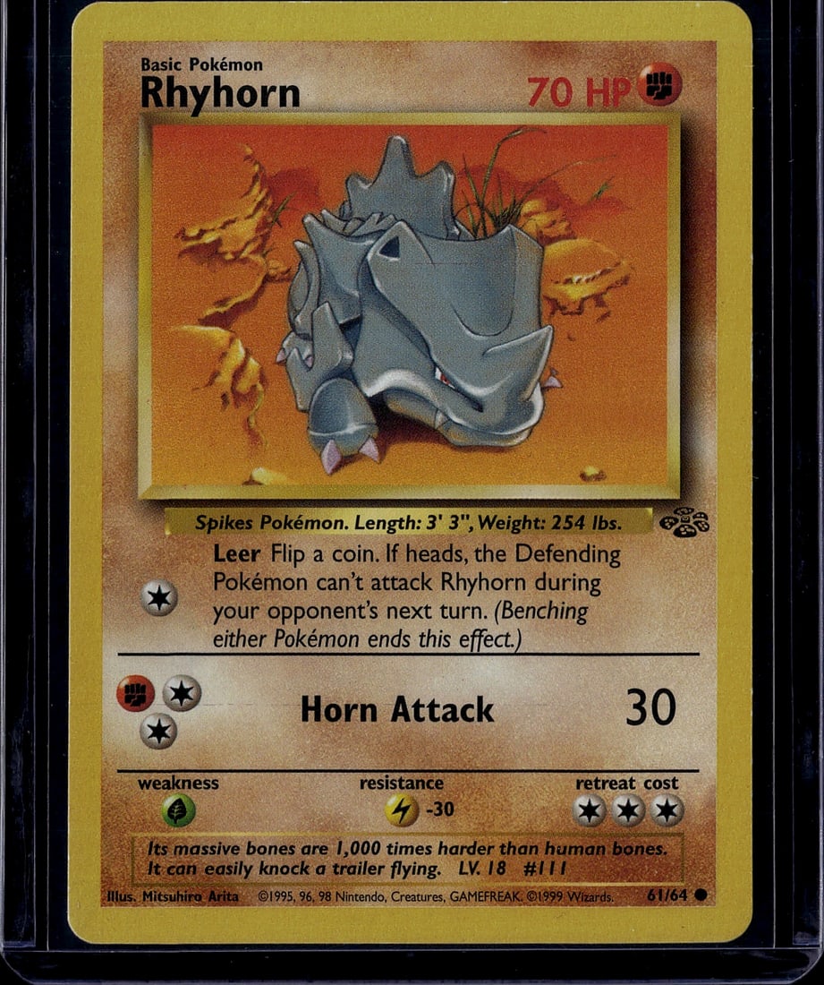 1999 Pokemon Base Set Rhyhorn 61/64 TCG Card: This is a 1999 Pokemon Trading Card Game Base Set Rhyhorn card, card number 61/64. Rhyhorn is a Basic Ground-type Pokemon featuring 70 HP and iconic artwork by illustrator Mitsuhiro Arita. The card di