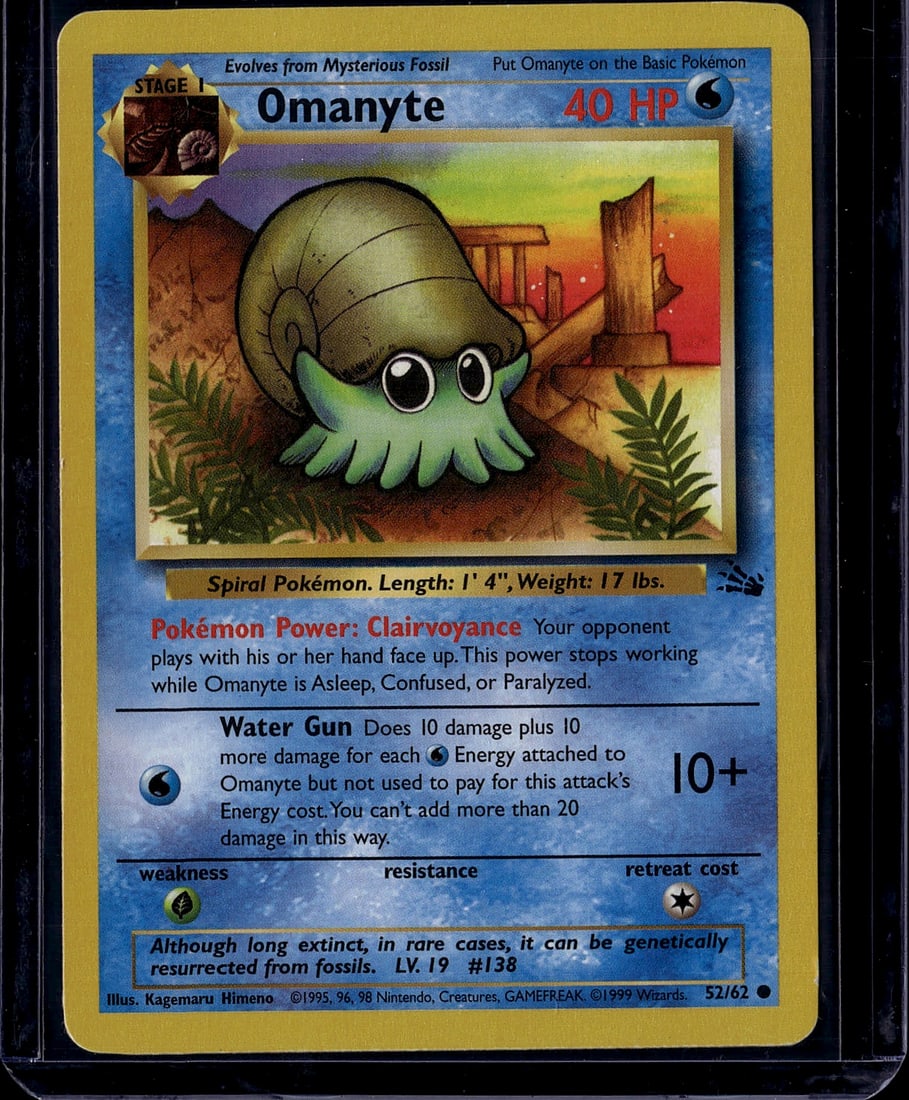 Omanyte Base Set 52/62 1999 Pokemon Card Stage 1: This is an original 1999 Pokemon Base Set Omanyte card (#52/62), a Stage 1 Water-type Spiral Pokemon that evolves from a mysterious fossil. The card features iconic artwork by Kagemaru Himeno and