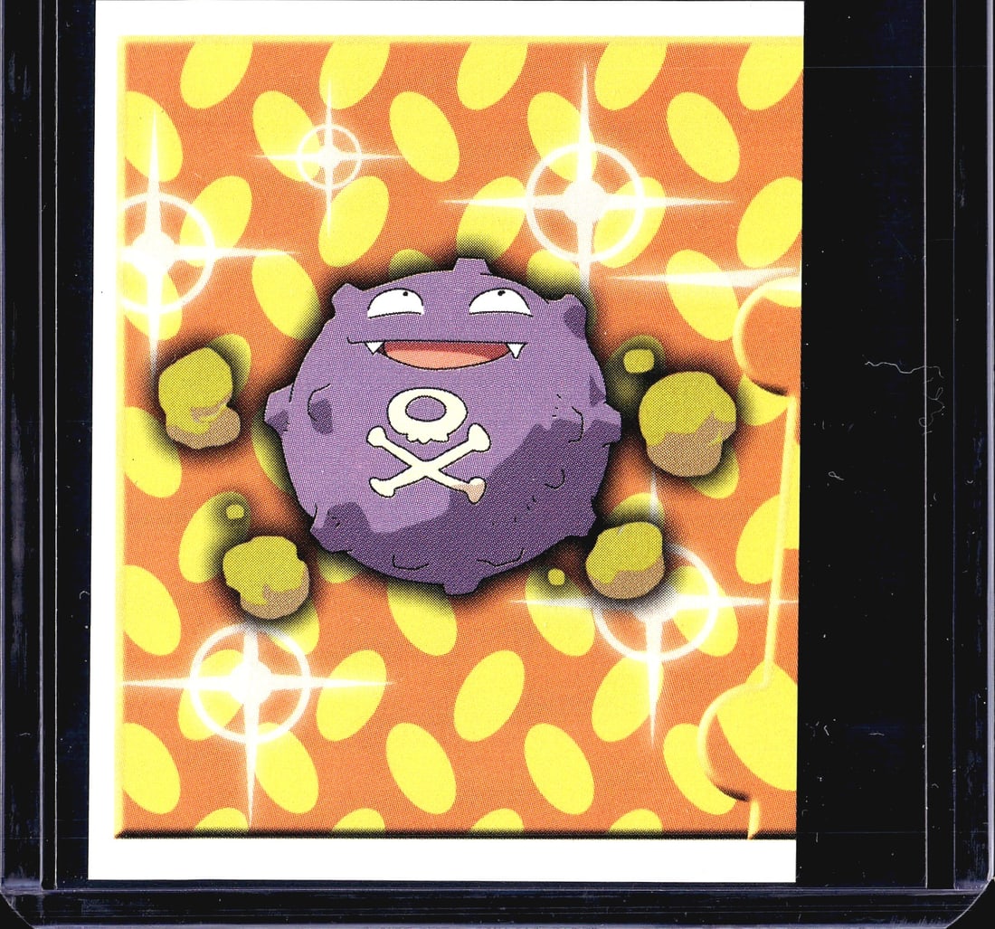 1999 Merlin Topps Pokemon Series 1 #215 Koffing: This is a 1999 Merlin Collections Pokemon sticker numbered 215, featuring Koffing on a holographic foil orange background with yellow dot pattern and sparkle effects. The front displays Koffing's