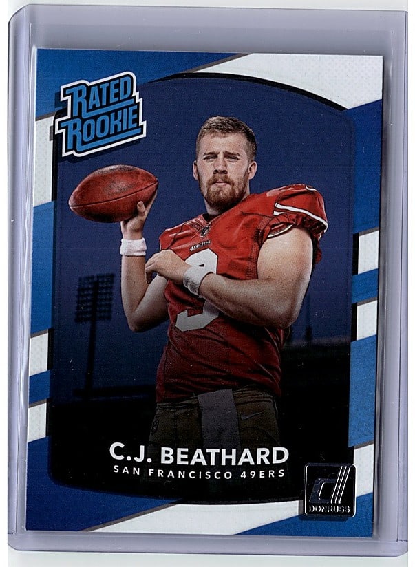 2017 Donruss C.J. Beathard #320 Rated Rookie: This is a 2017 Panini Rookie Phenoms #9 C.J. Beathard single card featuring the San Francisco 49ers quarterback. The card showcases Beathard in his rookie season uniform with a red jersey, captured in