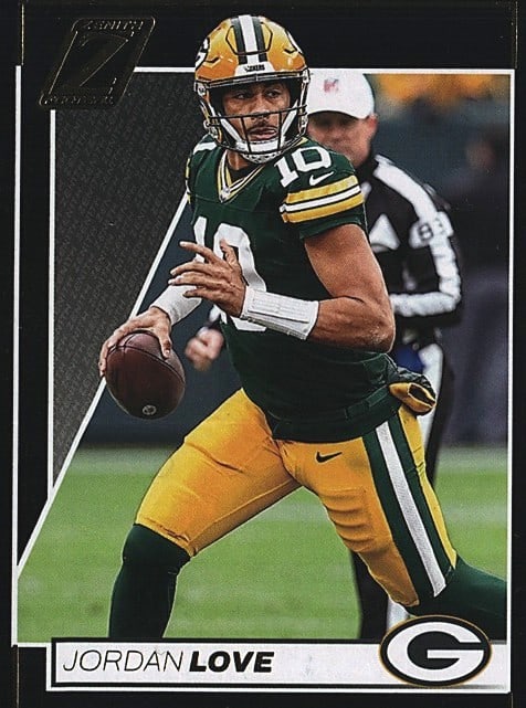 2020 Panini Chronicles Jordan Love Rookie Card: Raw single sports card featuring quarterback Jordan Love from the 2020 Panini Contenders set. The card displays Love in his Green Bay Packers uniform mid-play, holding the football. This is an ungrade