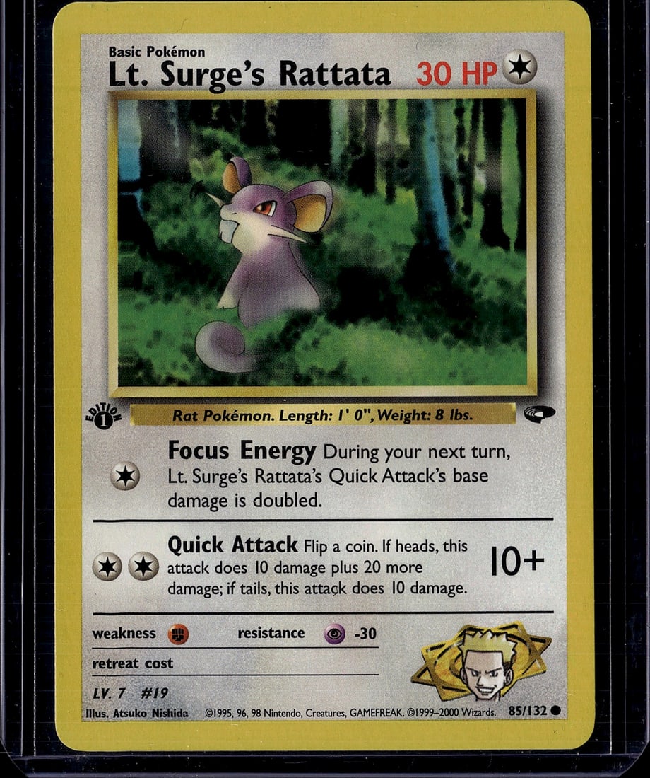 Lt. Surge's Rattata 85/132 Gym Heroes 1999: This is an original Lt. Surge's Rattata Pokemon trading card from the Gym Heroes set, released in 1999. The card features the iconic rat Pokemon illustrated by Atsuko Nishida, with vibrant artwork dep