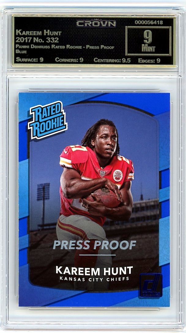 2017 Kareem Hunt Panini Donruss Rated Rookie: This is a 2017 Kareem Hunt card from the Panini Donruss Rated Rookie Press Proof Blue set, card number 332. It's a graded rookie card of the running back, captured during his entry into professional f