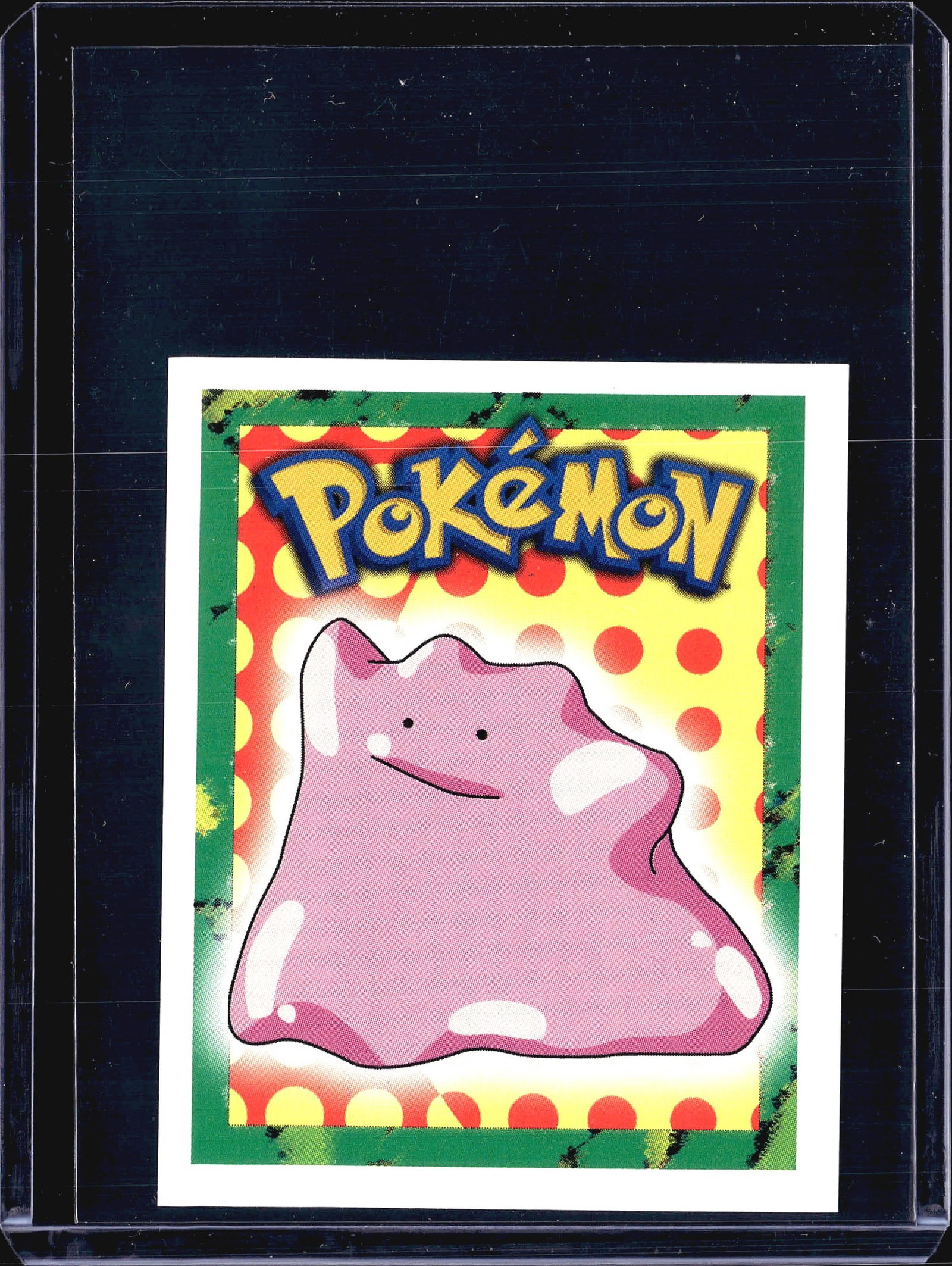 1999 Merlin Pokemon Sticker #132 Ditto Nintendo: This listing features sticker #132 from the 1999 Merlin Pokemon Sticker Collection, depicting Ditto - the Transform Pokemon - against a colorful polka-dot background with the iconic Pokemon logo. The 