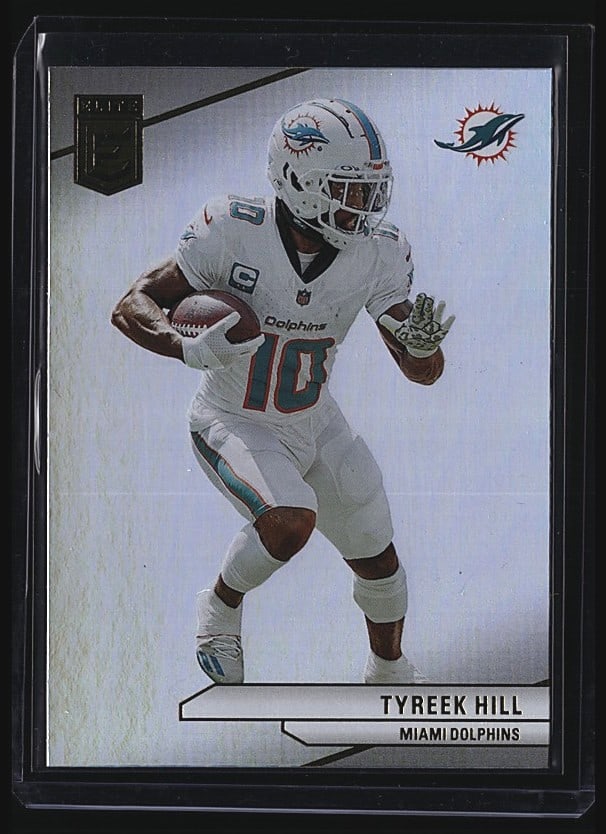 2024 Panini Donruss Elite #77 Tyreek Hill Miami: 2024 Panini Donruss Elite Football #77 Tyreek Hill, Miami Dolphins. Raw single card in Mint condition. Card features Hill in Dolphins white uniform with number 10 visible on the front. Reverse display
