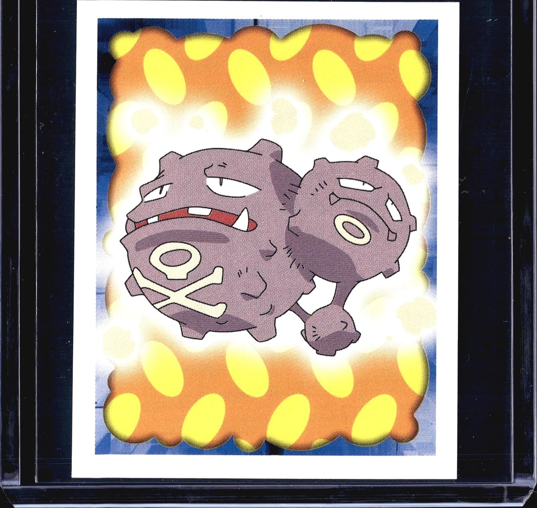 1999 Merlin Pokemon Sticker #110 Weezing Holo: This is sticker #110 from the 1999 Merlin Collections Pokemon sticker series, featuring Weezing, the Poison-type Pokemon. The front displays a vibrant orange and yellow flame-style holographic border