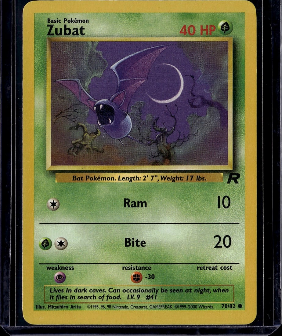 Zubat Base Set 70/82 Pokemon Card 1999 Wizards: This is a raw Zubat Pokemon card from the classic Base Set released in 1999 by Wizards of the Coast. Card number 70/82, this Basic Pokemon features the iconic bat creature with its two attacks: Ram (1