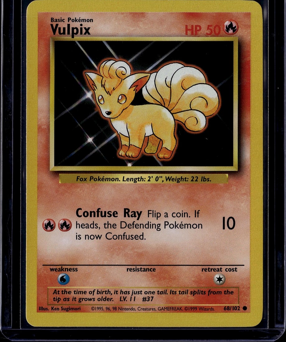 1999 Pokemon Base Set Vulpix Card #68/102: This is an authentic 1999 Pokemon Trading Card Game Base Set Vulpix card, card #68/102. Vulpix is a Fire-type Basic Pokemon featuring the classic Ken Sugimori illustration with its distinctive multi-t