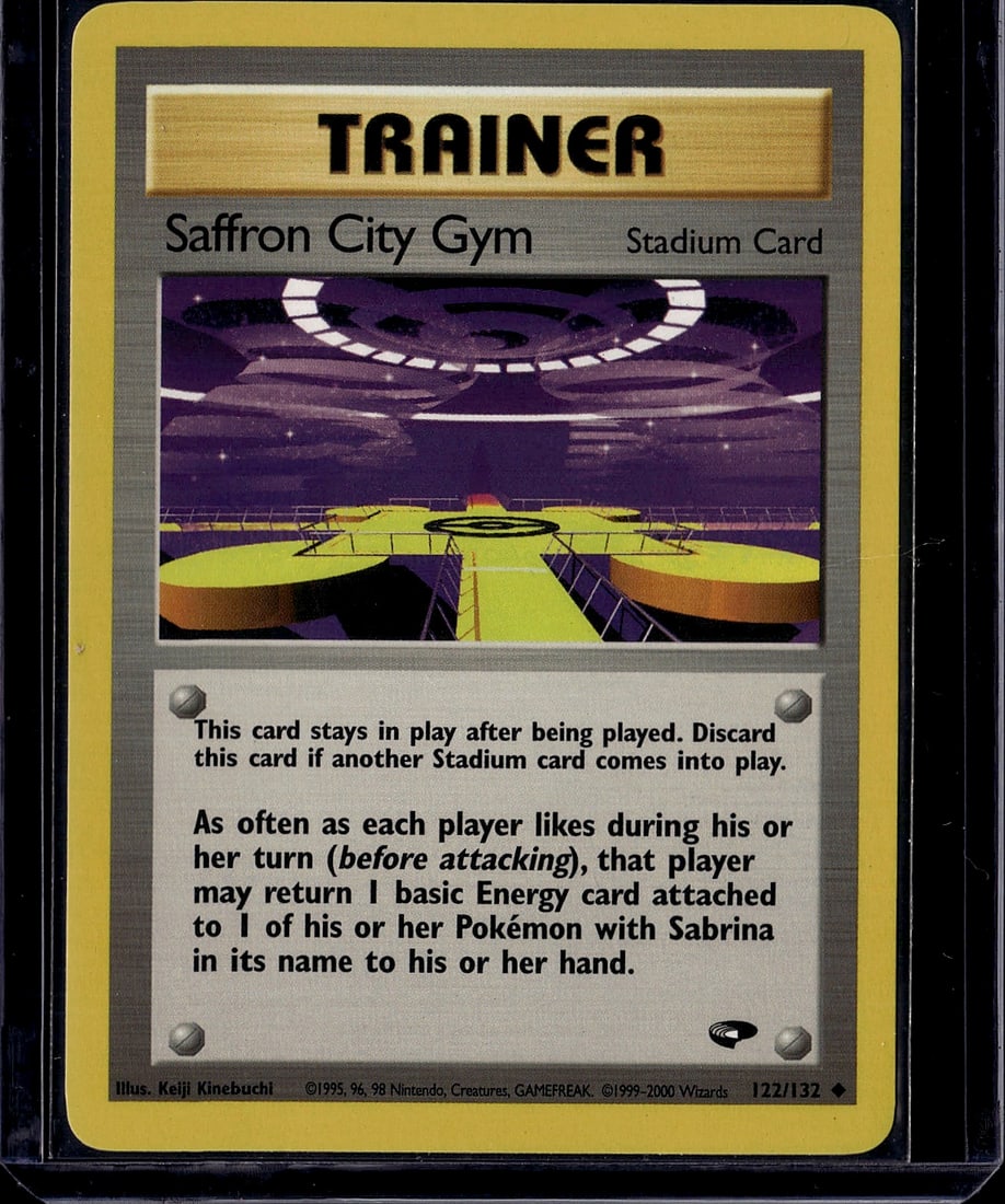 Saffron City Gym Trainer Stadium Card 122/132: This is an ungraded Saffron City Gym Trainer Stadium card from the 1999 Pokemon Gym Heroes set, card #122/132. Stadium cards are utility trainers that provide ongoing effects during gameplay and