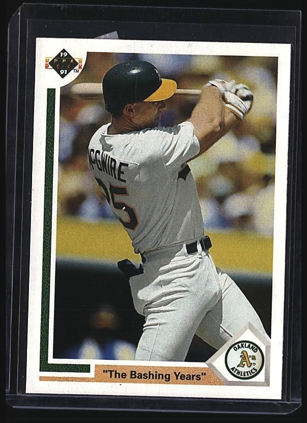 1991 Upper Deck Mark McGwire #656 Baseball Card: 1990 Upper Deck Mark McGwire #656 raw single card featuring the Oakland Athletics slugger mid-swing. The card showcases McGwire during his early career years with the A's, before his record-breaking 7