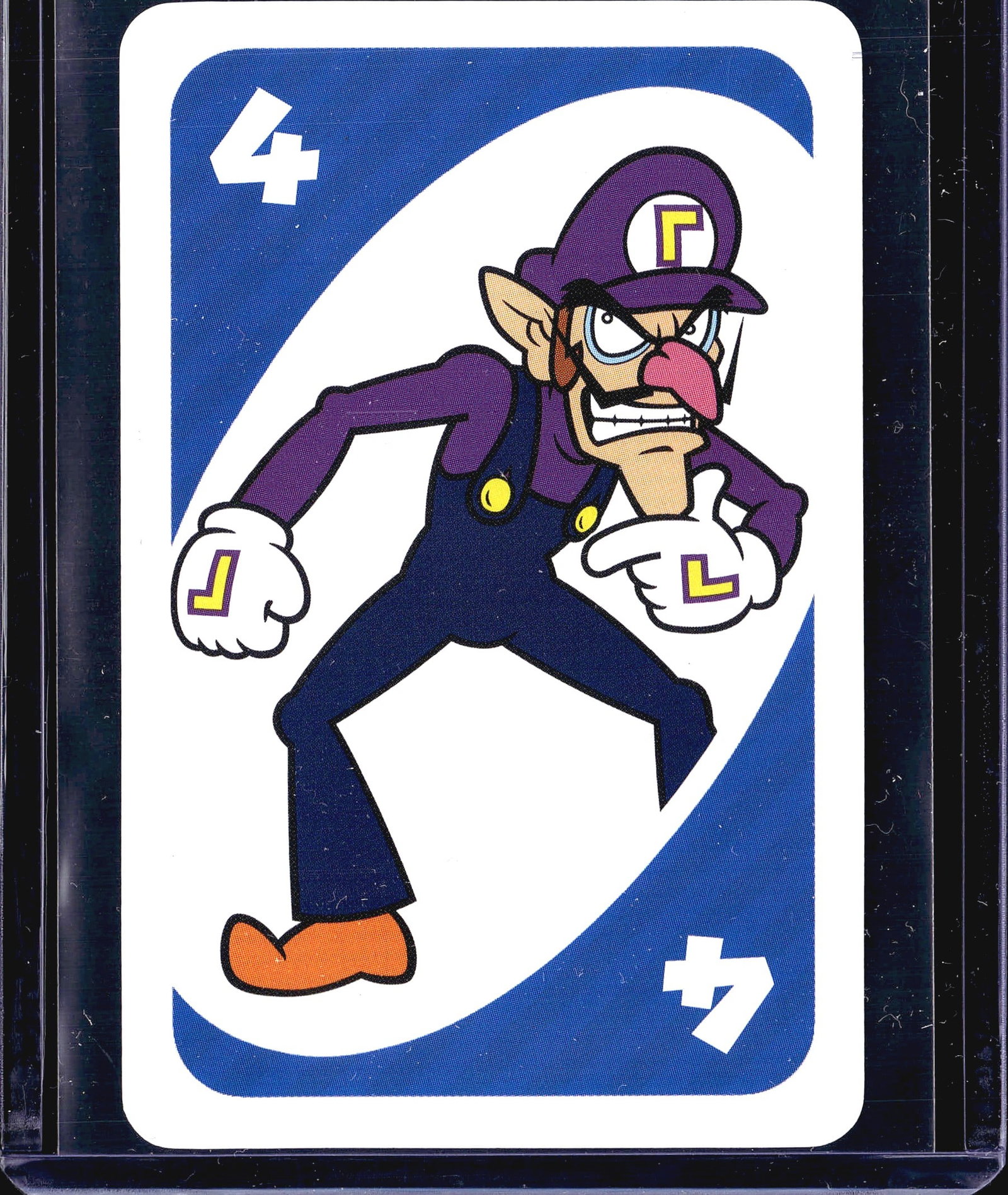 Nintendo UNO Card Game 4 Character Card - Waluigi: This lot contains a single vintage UNO-style card featuring a classic cartoon character in purple uniform with the number 4 printed in the top-left and bottom-right corners. The card displays bold