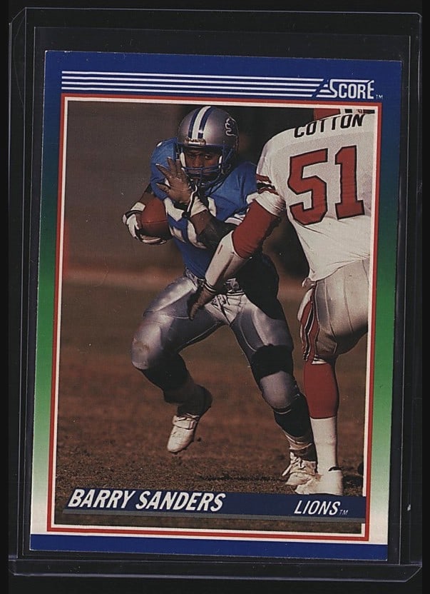 1990 Score Barry Sanders #20 Football Card Very: 1989 Score Barry Sanders #20 running back rookie card featuring the Detroit Lions. This is a raw single in very good condition showing moderate wear consistent with age and handling. The card displays
