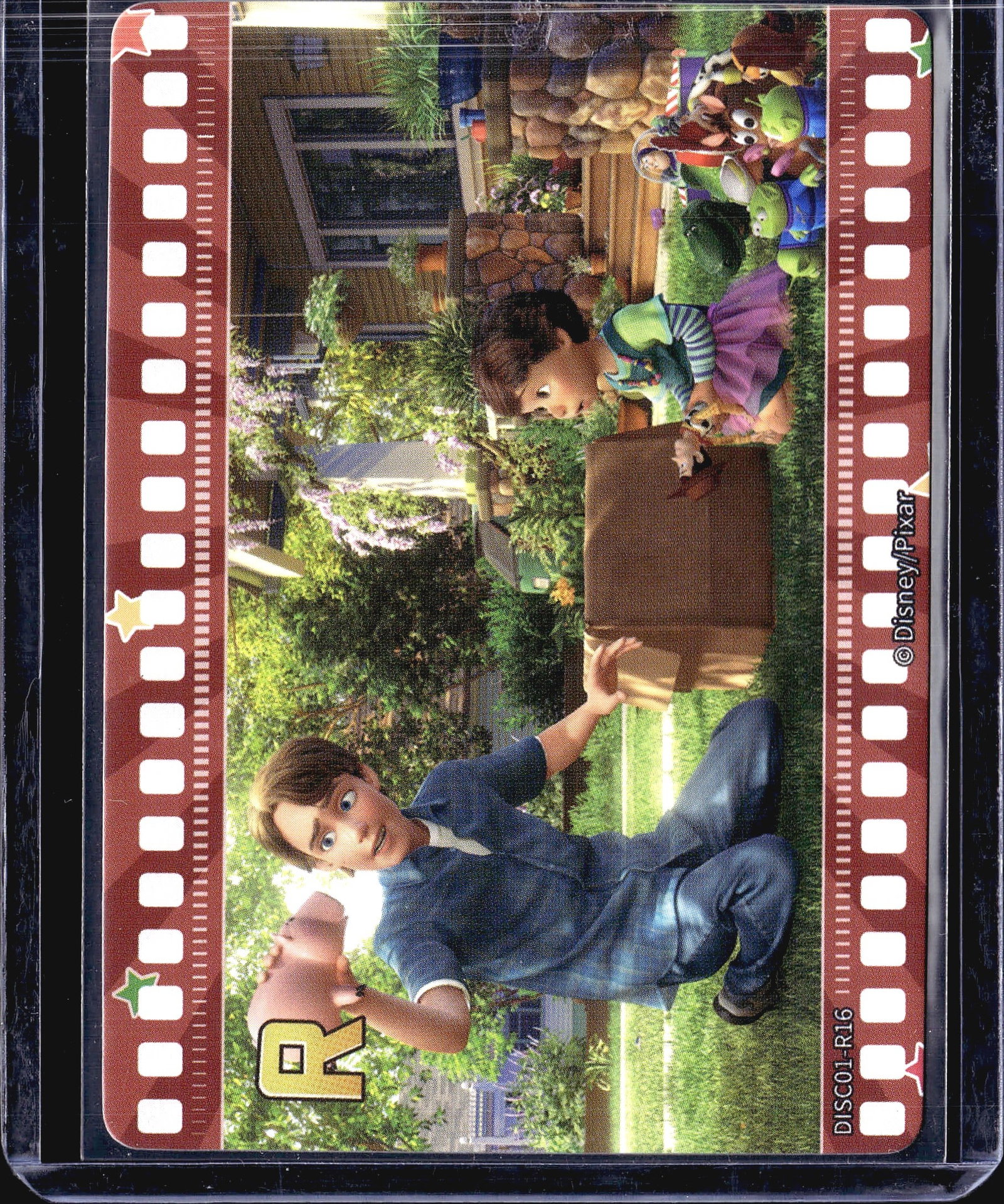 2023 Card.Fun Disney 100 Collection Pixar: This is a Disney/Pixar Toy Story trading card numbered DISC01-R16, featuring a film strip border design that frames a scene from the Toy Story franchise. The card depicts the character Andy alongside
