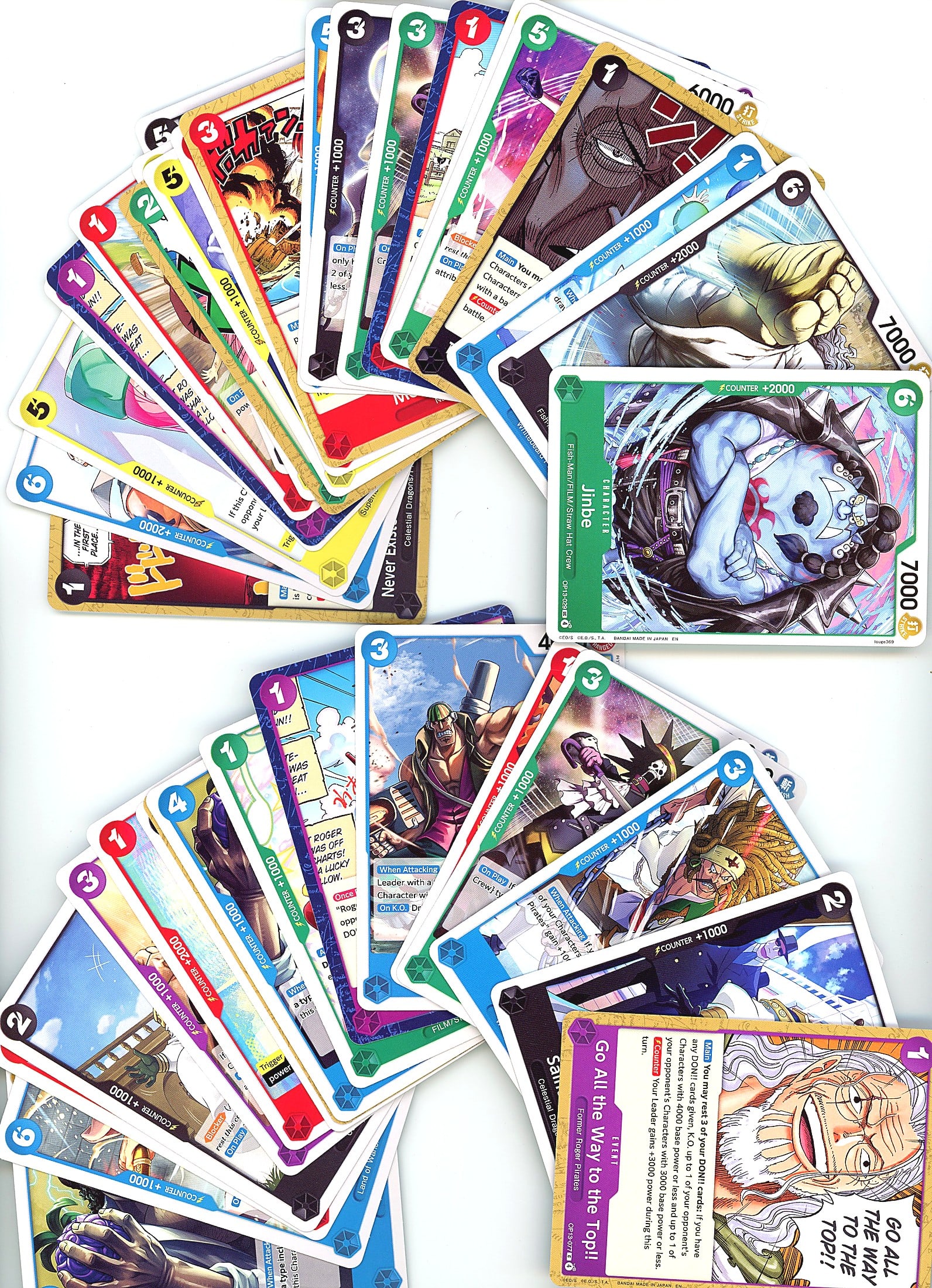 25+ One Piece Trading Cards Lot Bandai Modern TCG: This lot contains 25+ modern One Piece trading cards from Bandai, featuring a mix of standard finish cards across multiple series. The photo shows character artwork typical of the One Piece franchise,