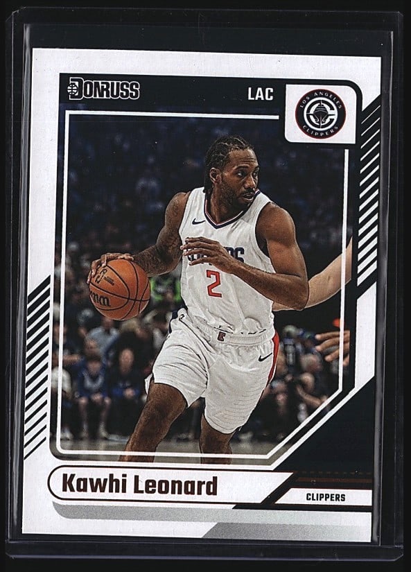 2024 Panini Donruss #171 Kawhi Leonard LA: 2024 Panini Donruss Basketball #171 Kawhi Leonard of the Los Angeles Clippers. Raw single card in mint condition. Front shows Leonard in white Clippers jersey #2 dribbling the basketball. Back